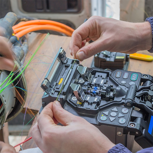 multi-colored fiber glass being tested in an electric contraption